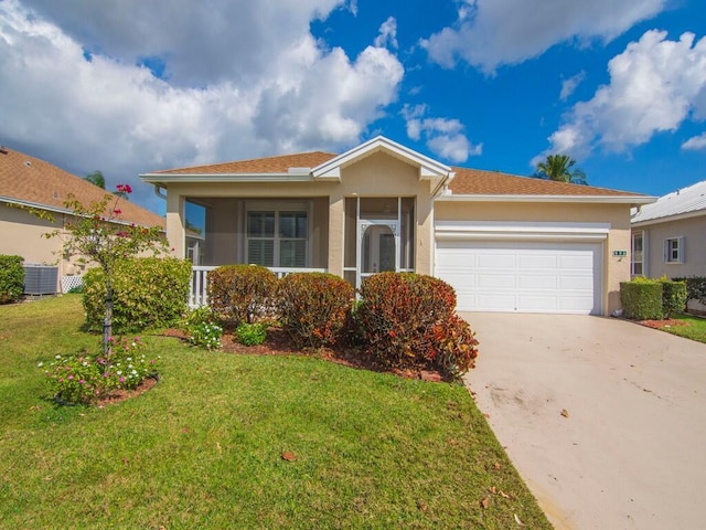 view of front of property featuring a garage and a front lawn