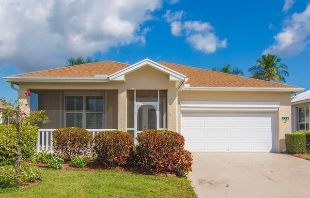 ranch-style home featuring a garage and a front lawn