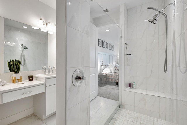 bathroom featuring vanity and a tile shower