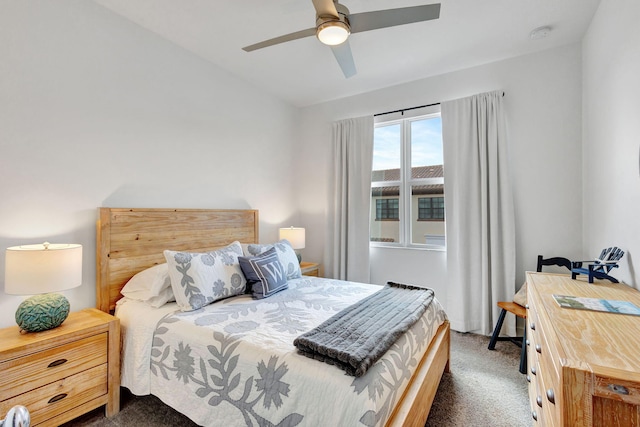 bedroom featuring ceiling fan and dark colored carpet