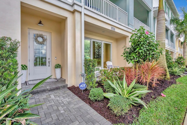 doorway to property featuring a balcony