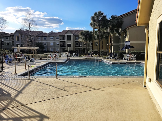 view of pool featuring a pergola and a patio area