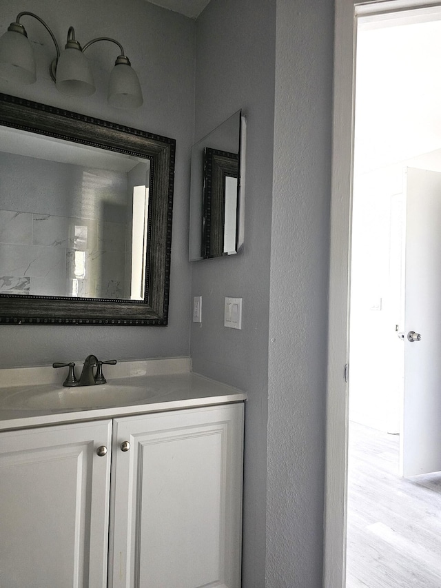 bathroom featuring vanity and wood-type flooring