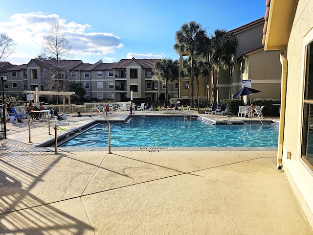 view of pool with a pergola and a patio area