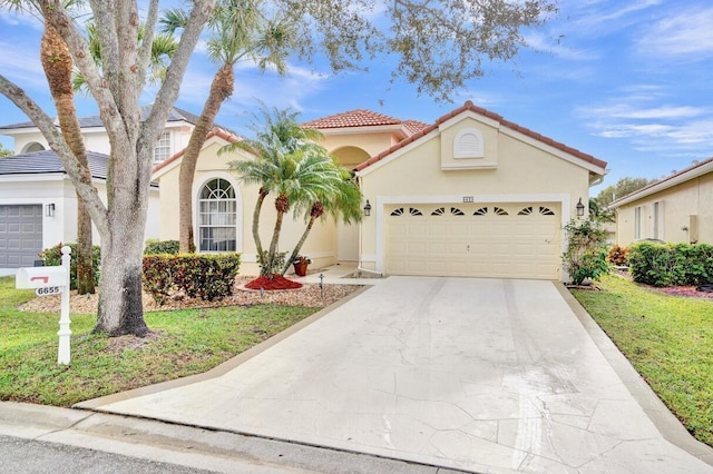 view of front facade with a garage and a front yard