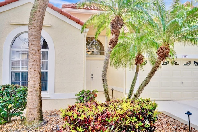 view of side of home with a garage