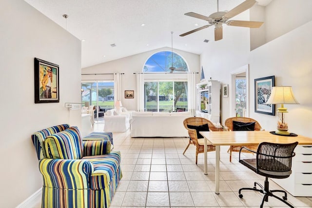 interior space featuring high vaulted ceiling and ceiling fan