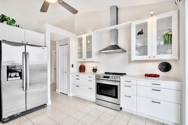 kitchen with white cabinetry, wall chimney exhaust hood, and appliances with stainless steel finishes