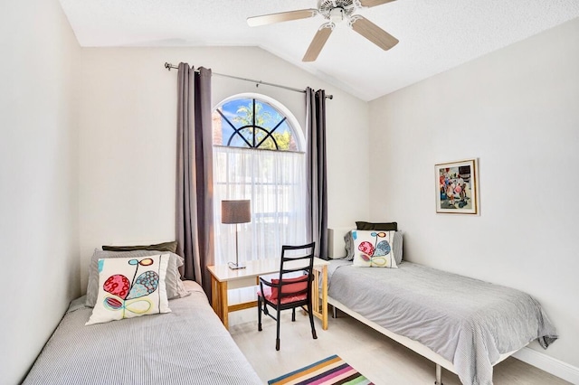 bedroom with lofted ceiling and ceiling fan