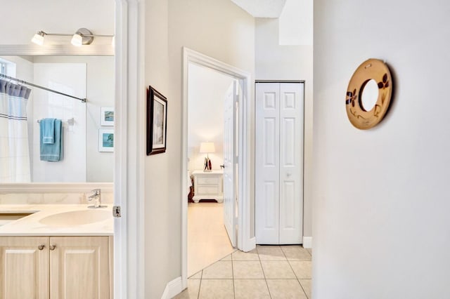 bathroom featuring vanity, tile patterned floors, and a shower with curtain