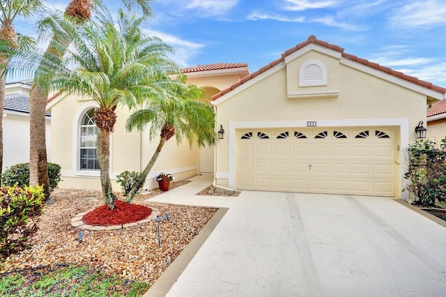 mediterranean / spanish-style house featuring a garage