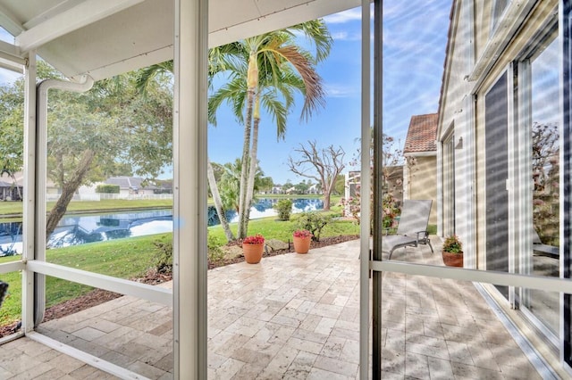 exterior space featuring a water view and a wealth of natural light