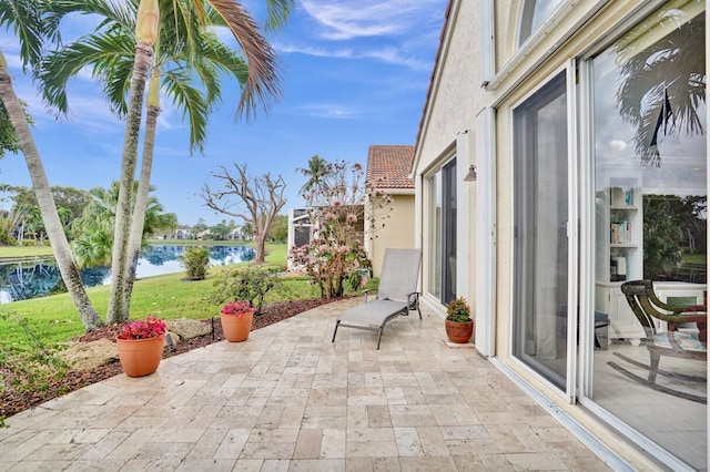 view of patio / terrace with a water view