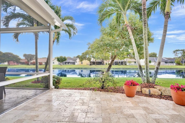 view of patio with a water view