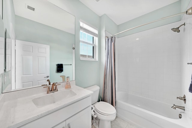 full bathroom featuring tile patterned floors, vanity, toilet, and shower / tub combo