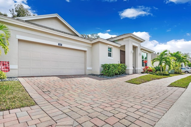 single story home featuring a garage