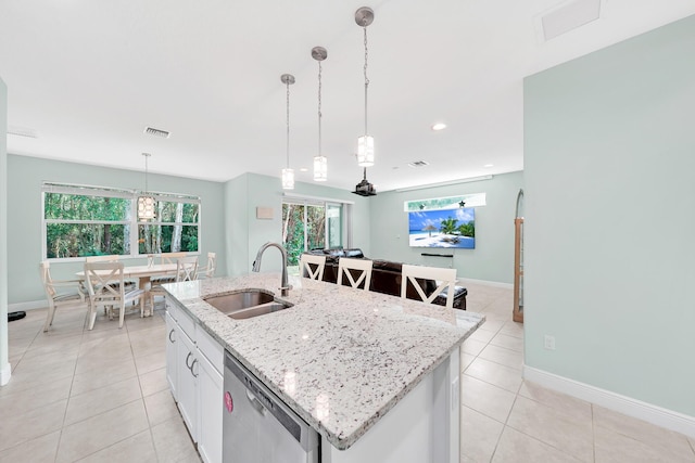 kitchen with sink, white cabinetry, hanging light fixtures, dishwasher, and a kitchen island with sink