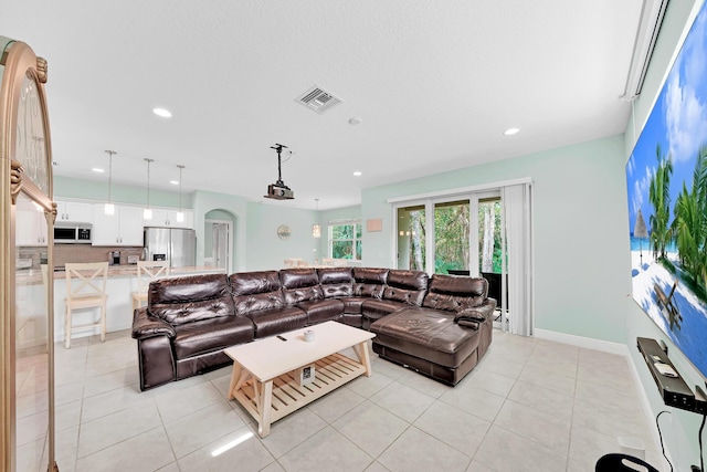 living room with light tile patterned flooring