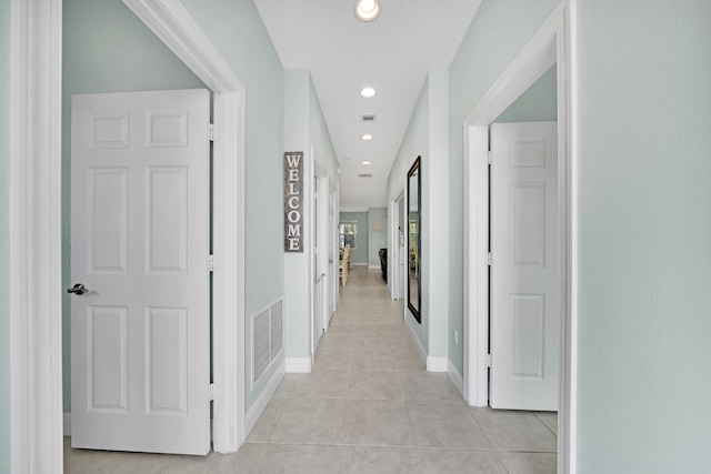 hallway with light tile patterned floors