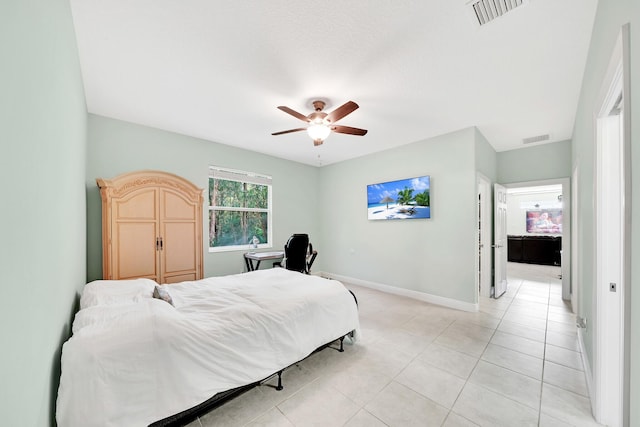 tiled bedroom with ceiling fan