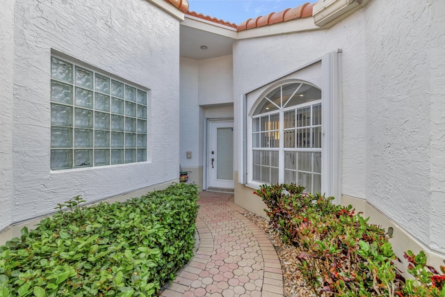 property entrance featuring an AC wall unit