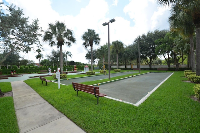 view of home's community featuring a lawn