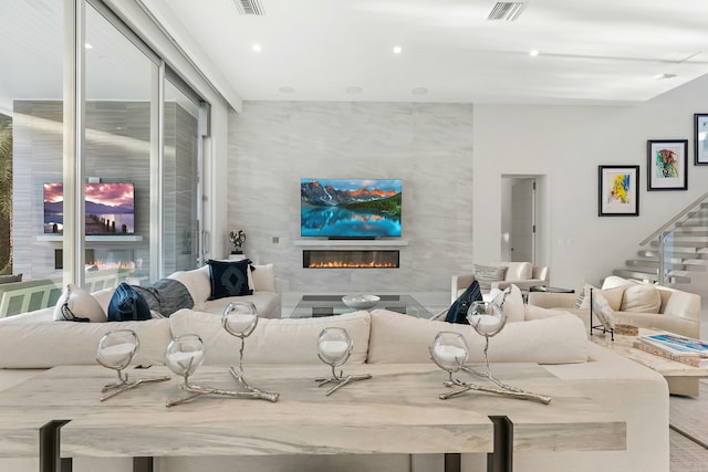 living room with a tiled fireplace