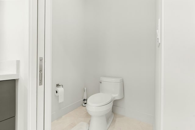 bathroom featuring tile patterned flooring and toilet