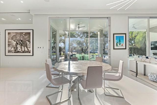 tiled dining room with ceiling fan