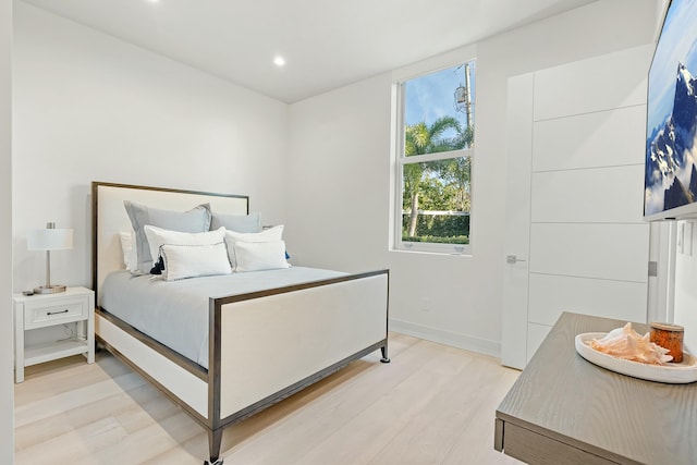 bedroom with light hardwood / wood-style flooring