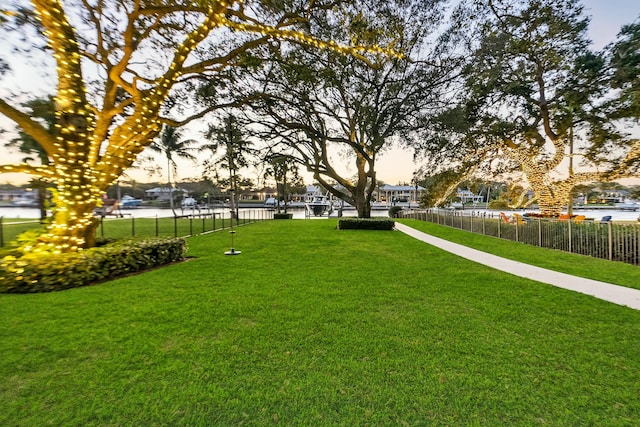 yard at dusk with a water view