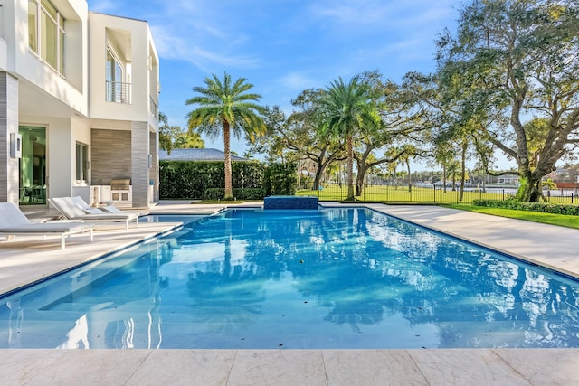 view of swimming pool featuring a patio