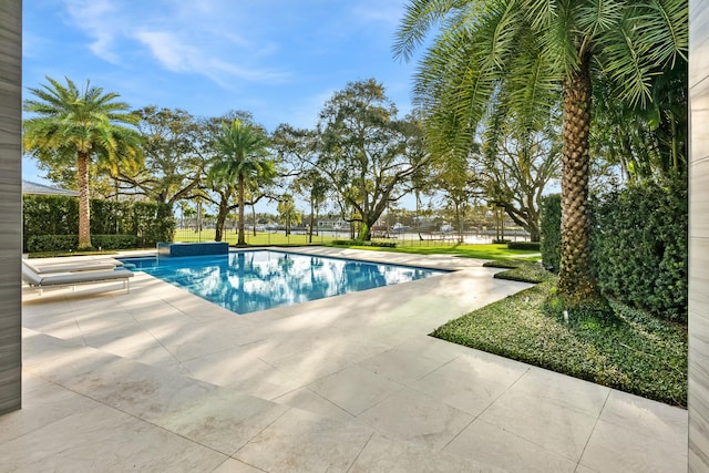 view of swimming pool with a patio area