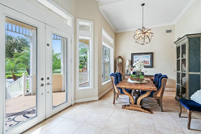 dining area with french doors, crown molding, a notable chandelier, light tile patterned floors, and visible vents