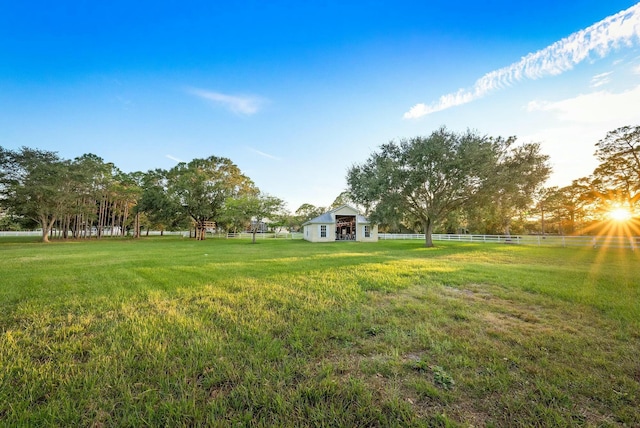 view of yard featuring fence and an outdoor structure