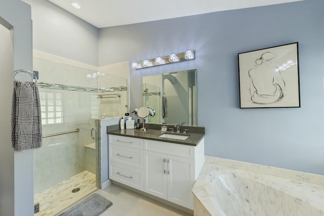 bathroom featuring vanity, tile patterned floors, and independent shower and bath