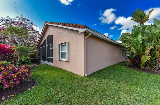 view of property exterior featuring a yard