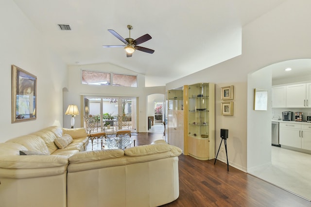 living room with high vaulted ceiling, dark wood-type flooring, and ceiling fan