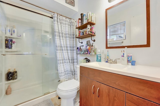 bathroom with toilet, vanity, and a shower with shower curtain