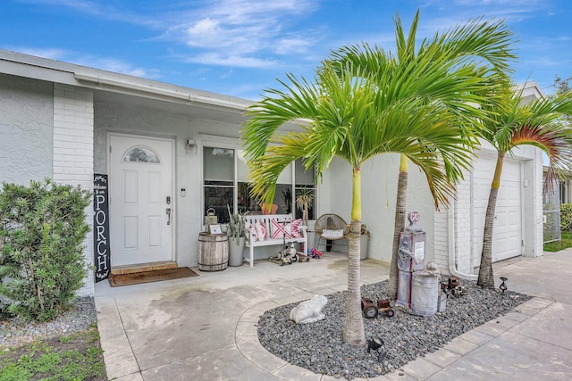 view of exterior entry featuring a garage