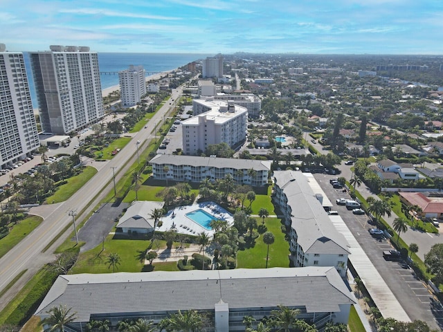 drone / aerial view with a city view and a water view