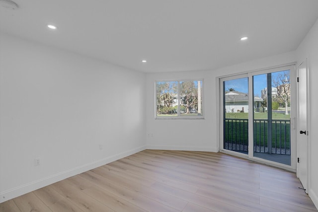 unfurnished room featuring baseboards, recessed lighting, and light wood-style floors