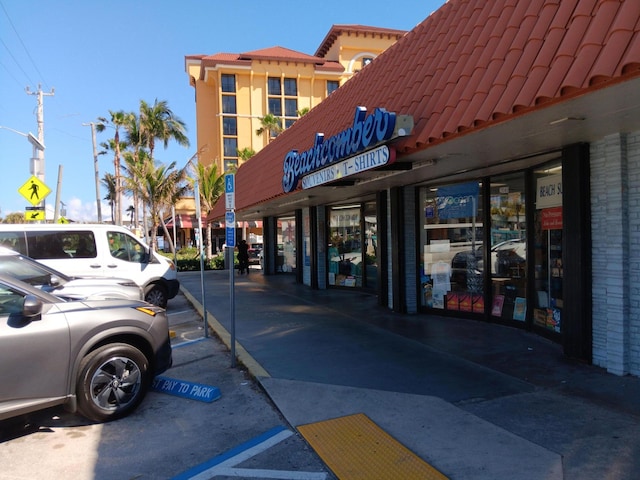 view of property featuring uncovered parking