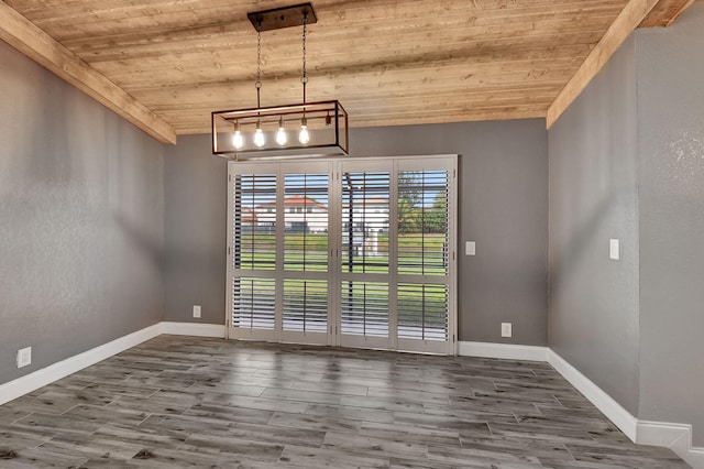 unfurnished dining area featuring wood ceiling, lofted ceiling, and hardwood / wood-style floors