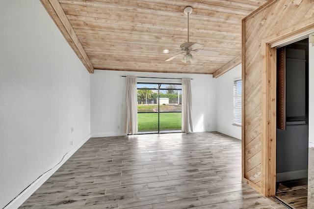 unfurnished room with ceiling fan, wood-type flooring, vaulted ceiling, and wooden ceiling