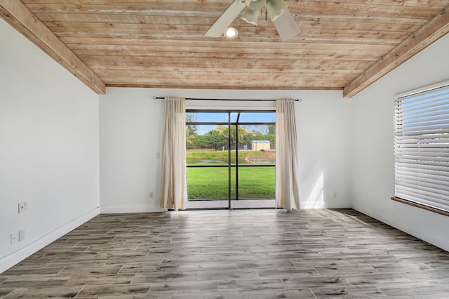 empty room with wood ceiling, ceiling fan, vaulted ceiling, and light hardwood / wood-style flooring