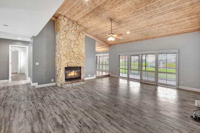 unfurnished living room with high vaulted ceiling, a fireplace, wood-type flooring, ceiling fan, and wood ceiling