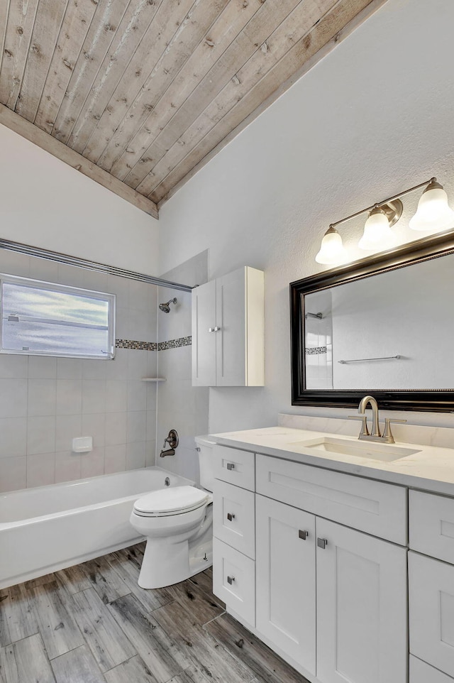 full bathroom with toilet, wood ceiling, vanity, tiled shower / bath combo, and hardwood / wood-style floors