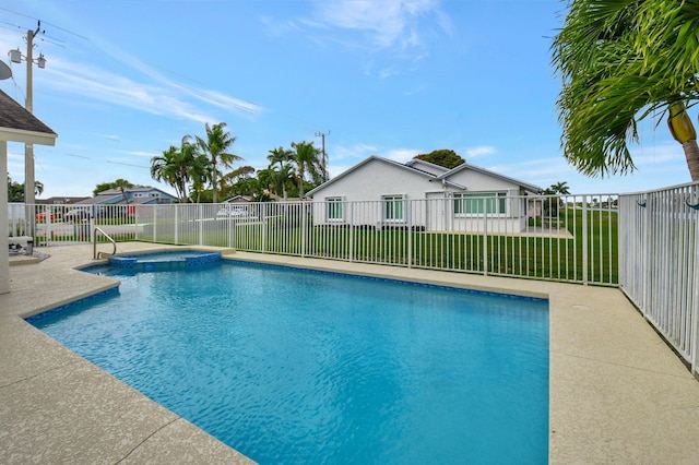 view of swimming pool with an in ground hot tub, a yard, and a patio area