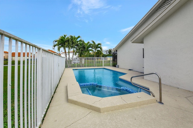 view of swimming pool with an in ground hot tub